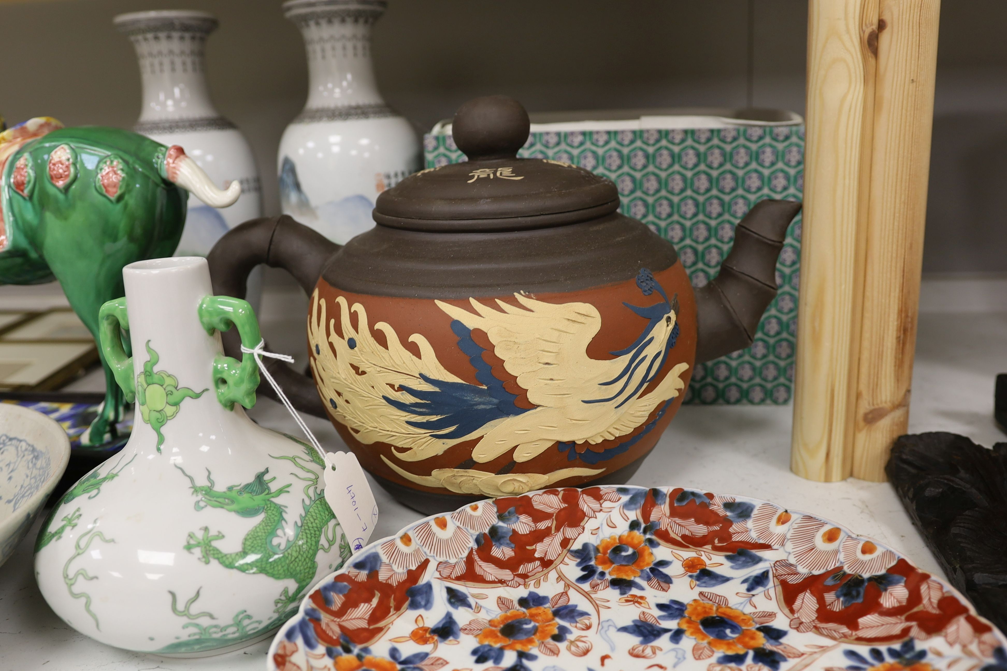 Various Chinese ceramics including a horse model, pair of horse vases, a dragon vase, a blue and white dish, large teapot, and an Imari plate (7)